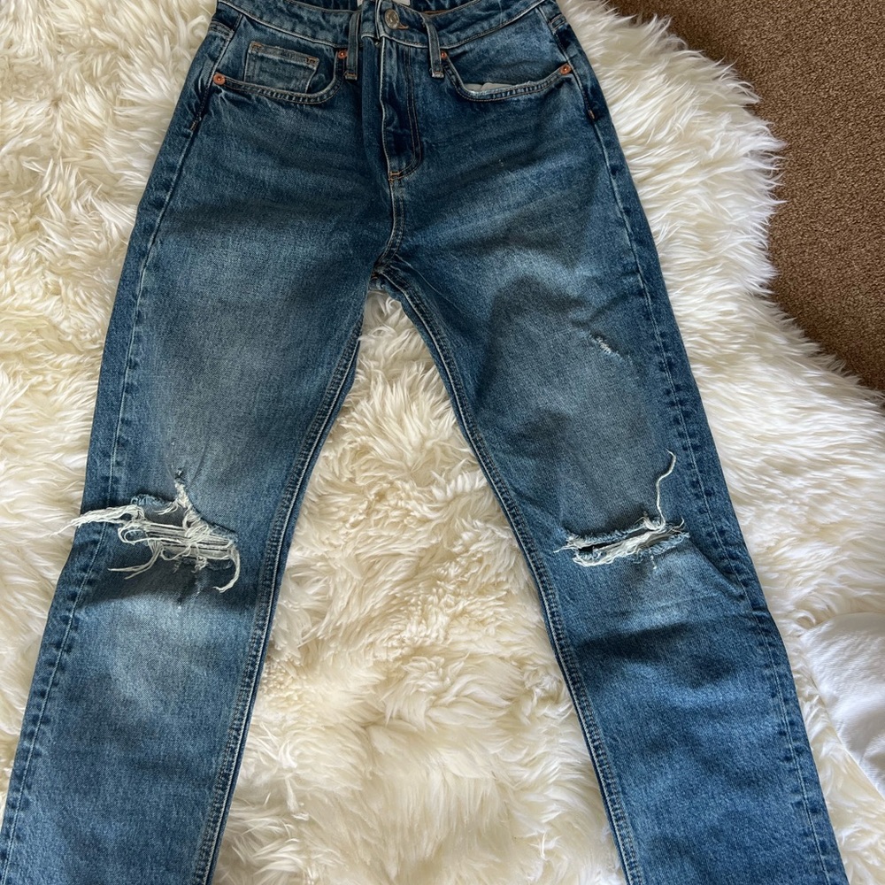 Zara blue ripped jeans. Very flattering and great condition. Worn once.